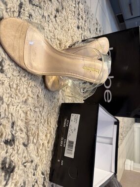 bebe “Yasmin” Clear Strap Nude Block-Heel Sandals